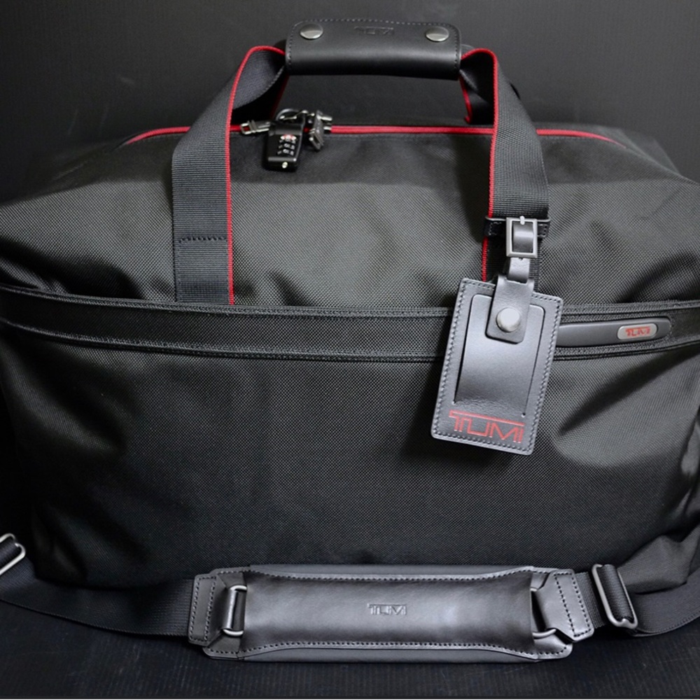 Tumi Black Duffel Bag with Red Highlights